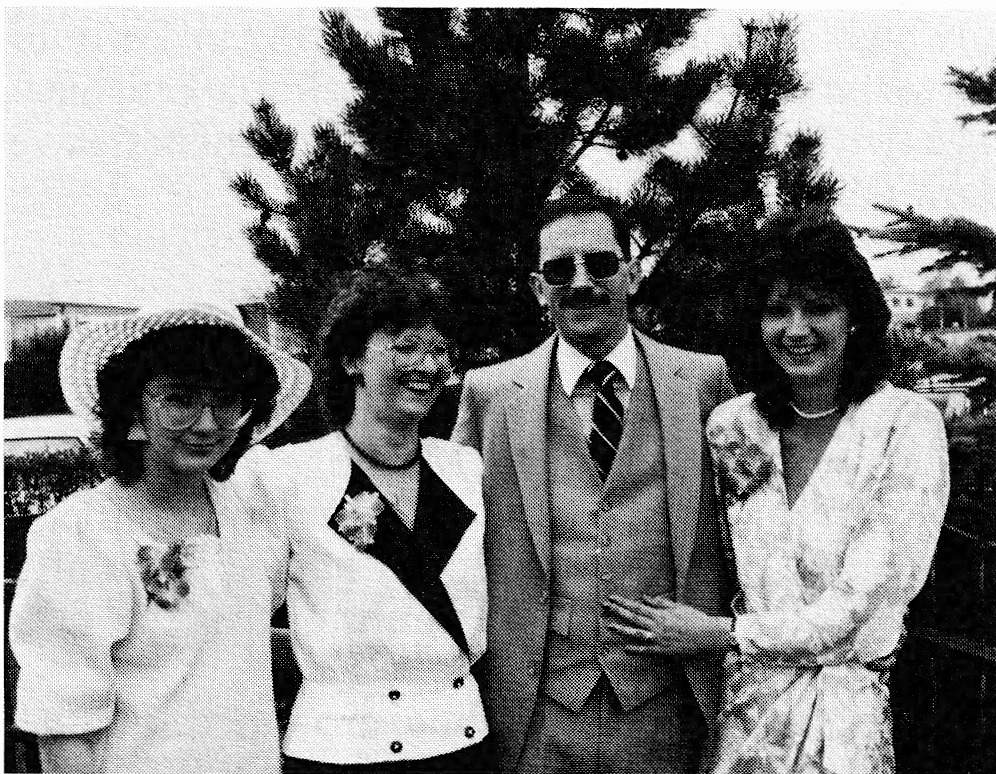 Photograph of four people outdoors