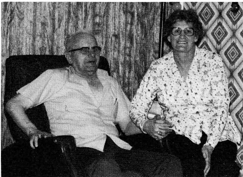 Black and white photograph of Angus and Marie Paule sitting together on a couch