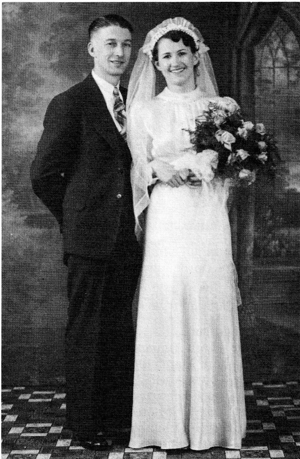Black and white photograph of a bride and groom