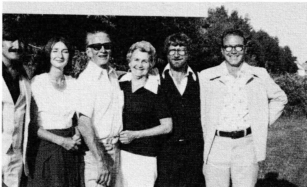 Group photo of six people outdoors