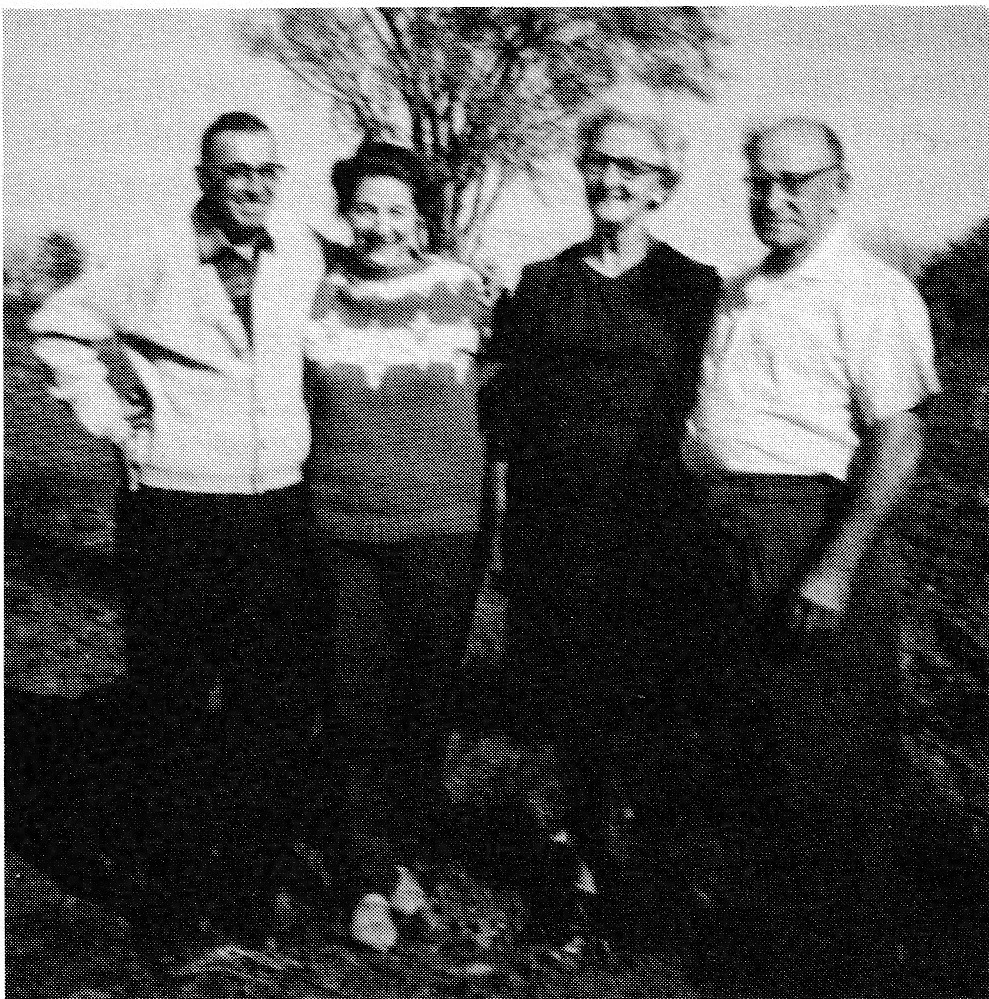 Four people standing outdoors