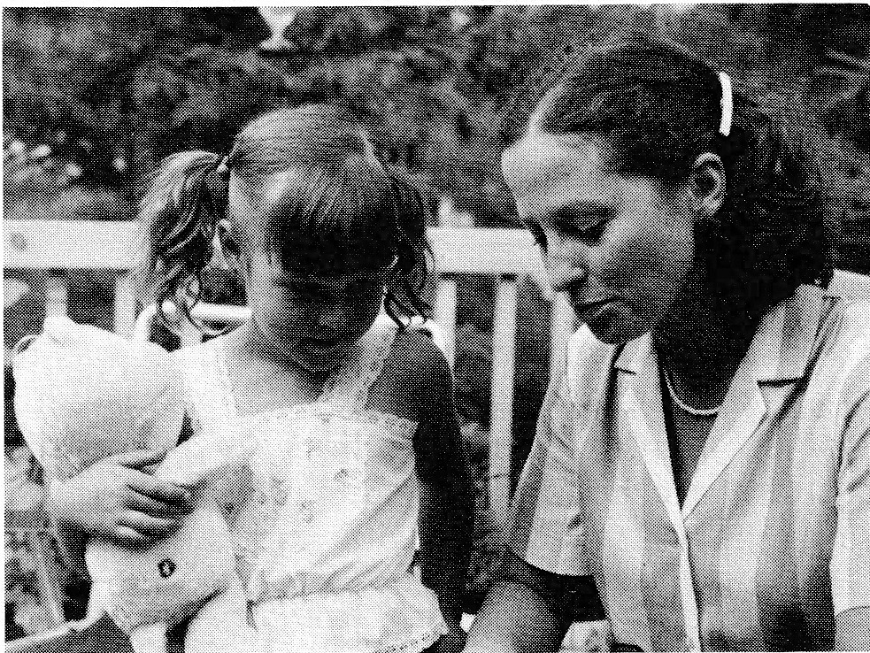 Woman and young girl holding a stuffed animal